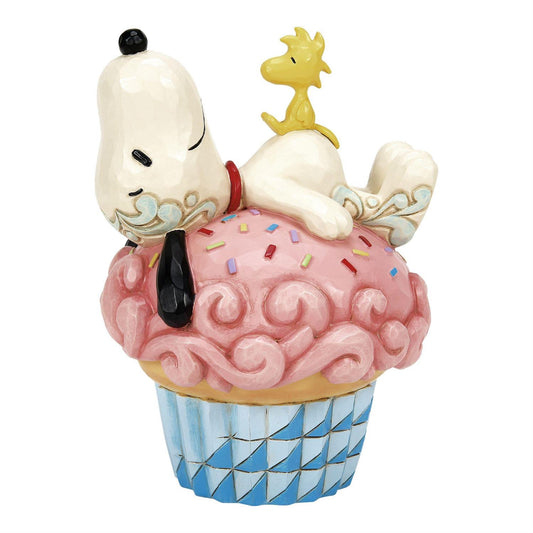 Snoopy Laying on Cupcake